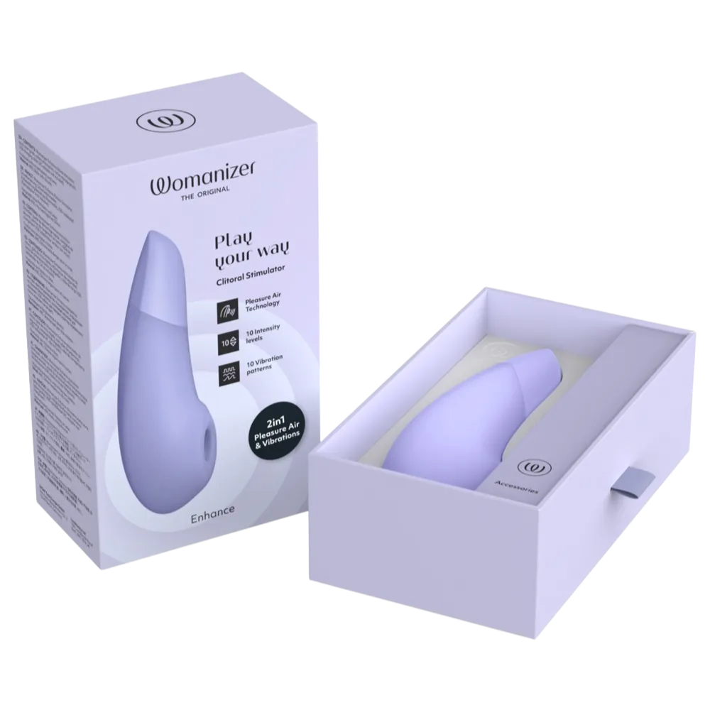 Womanizer Enhance lufttryksvibrator i elegant lilla æske. Kombinerer Pleasure Air Technology og vibrationer med 10 intensitetsniveauer og 10 mønstre. Diskret, stilfuldt intimprodukt designet til sanselig stimulering og moderne wellness.